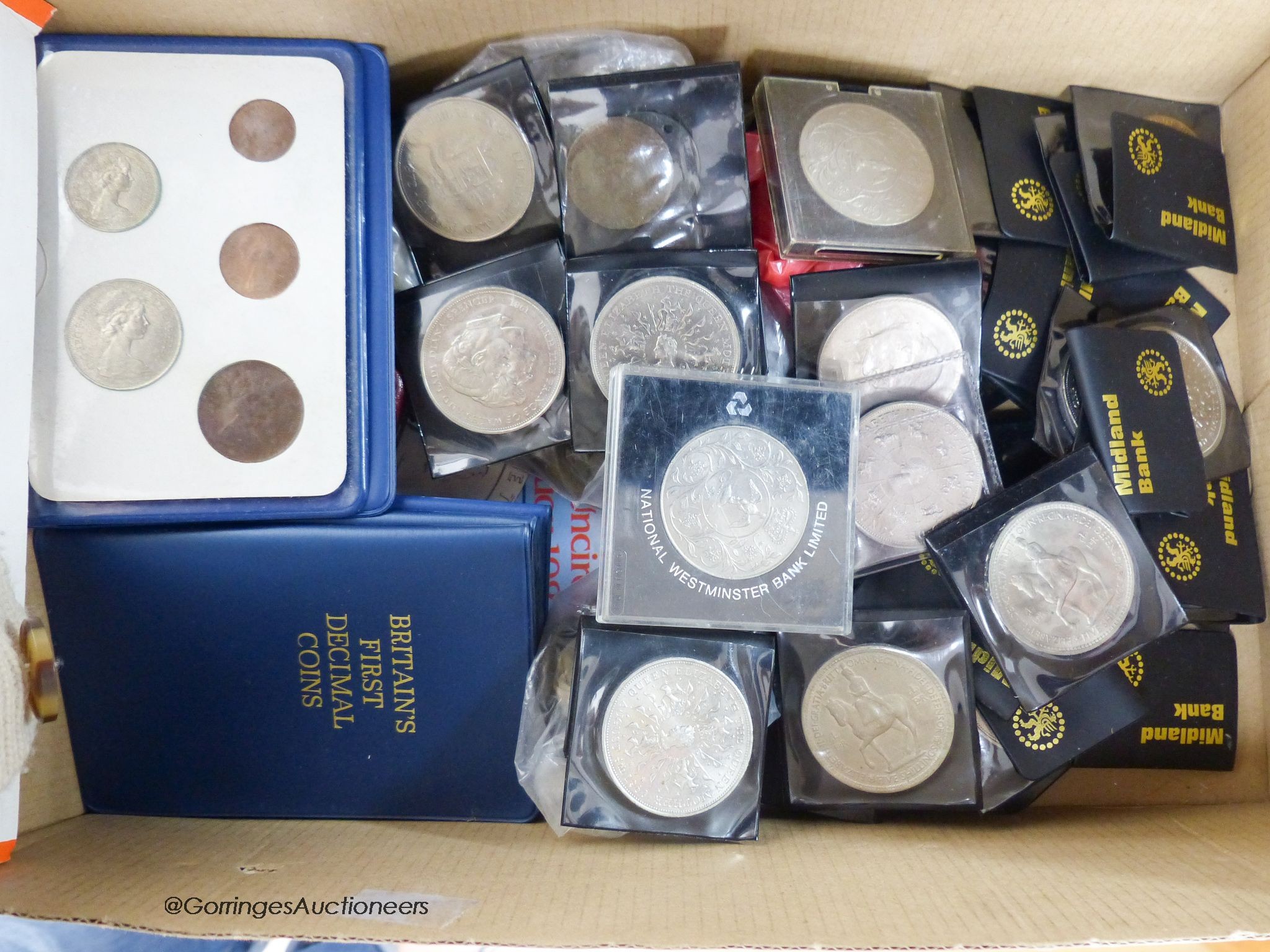 A collection of coins and banknotes, including William and Mary to Queen Elizabeth II copper and bronze coins, first decimal coin sets, commemorative coins and UK coin collection 1982 brilliant UNC